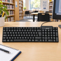 Teclado USB Basik Tech BSK08T Negro — escena de biblioteca escolar