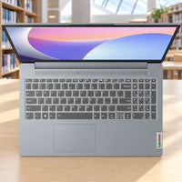 Lenovo IdeaPad Slim 3 15IRU8 gray, US layout — escena de biblioteca