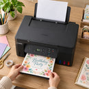 Impresora Canon PIXMA G2170 MegaTank multifuncional USB — vista superior preparando invitaciones